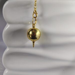 pendule doré sphérique